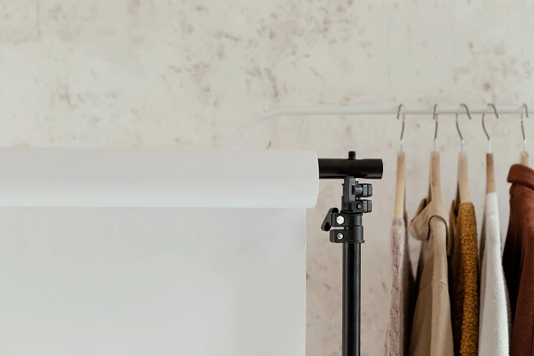 Clothes on a rail in a bright boutique