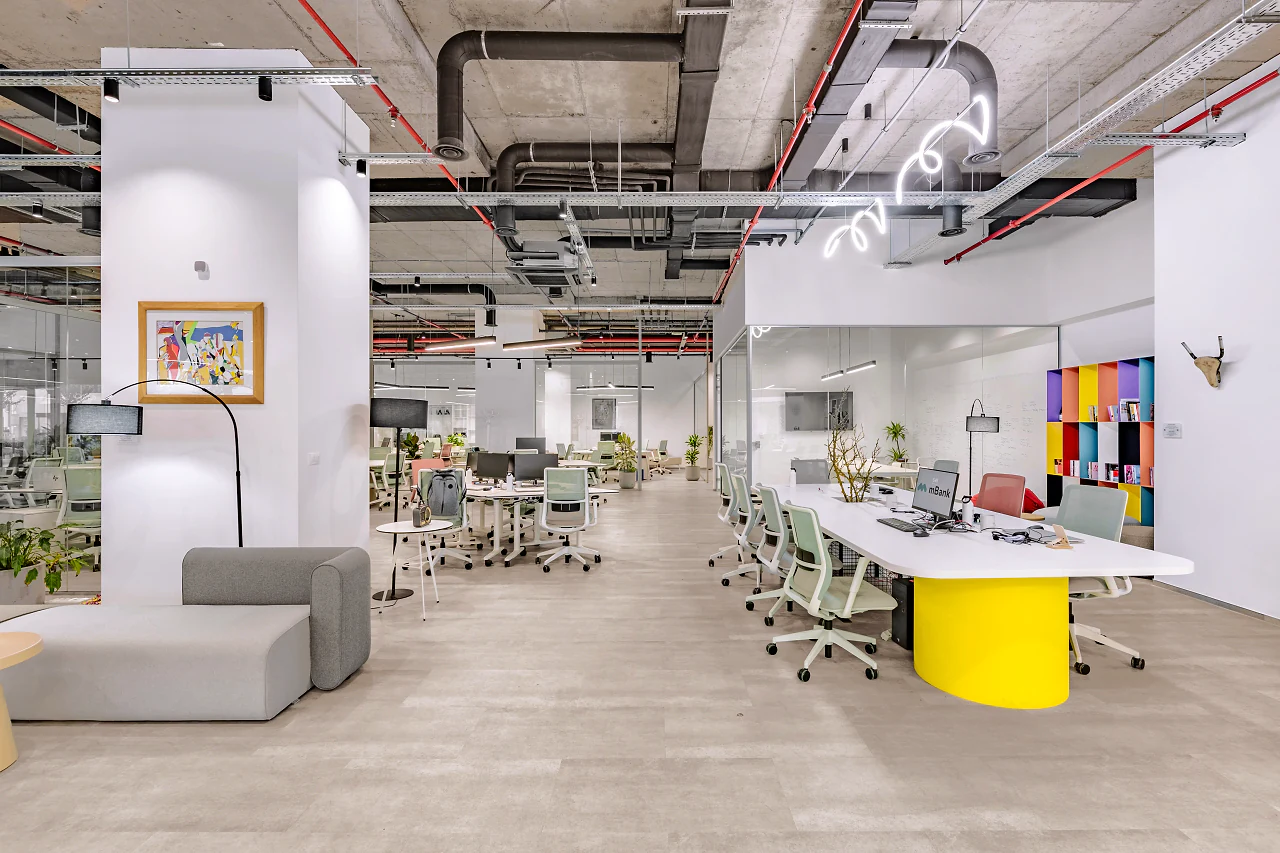 A lounge corner and a desk island on a bright yellow base