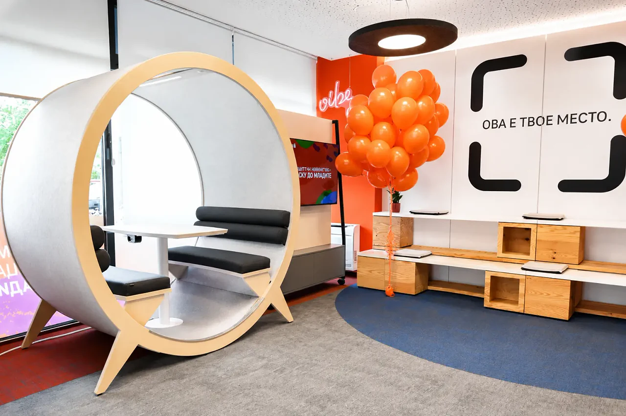 A sculptural timber pod seat in the open lounge