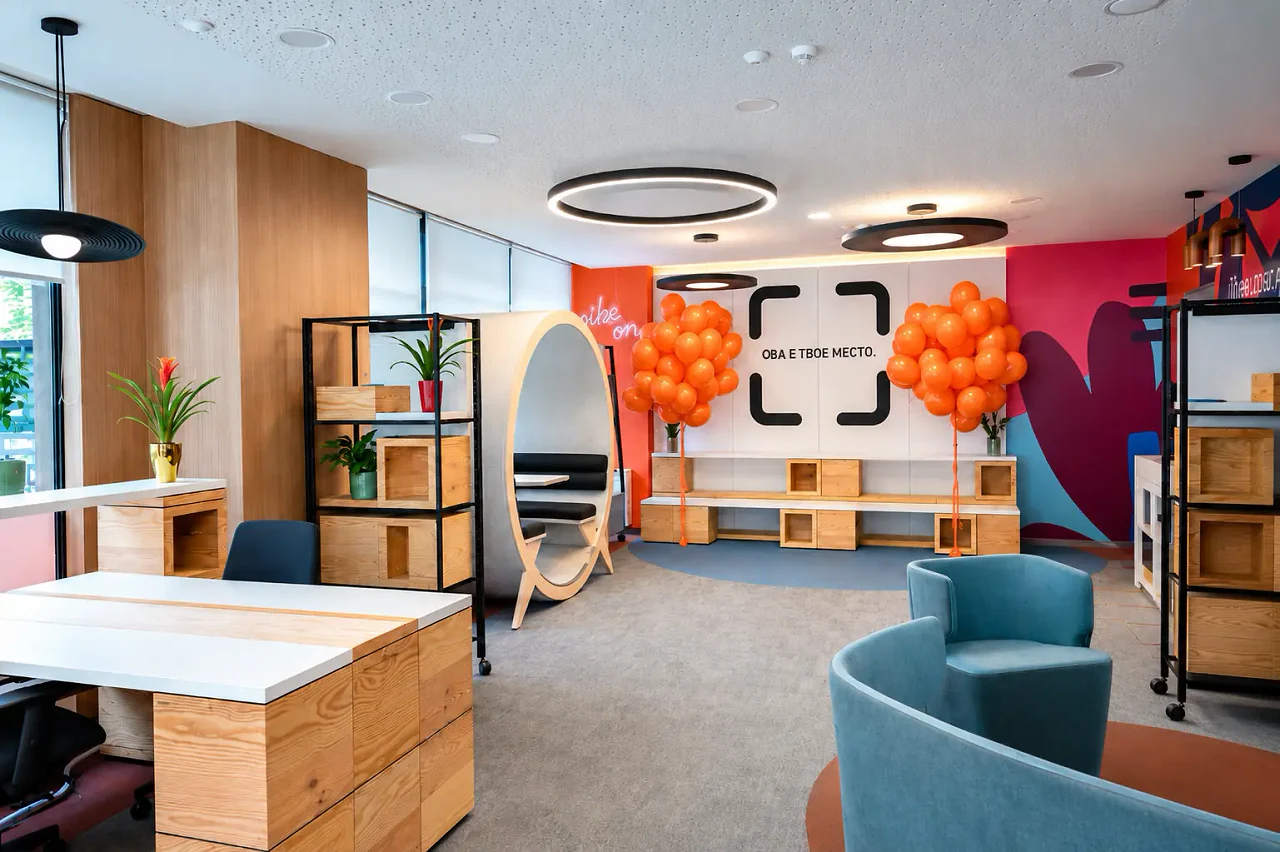 Open desks under circular pendant lights