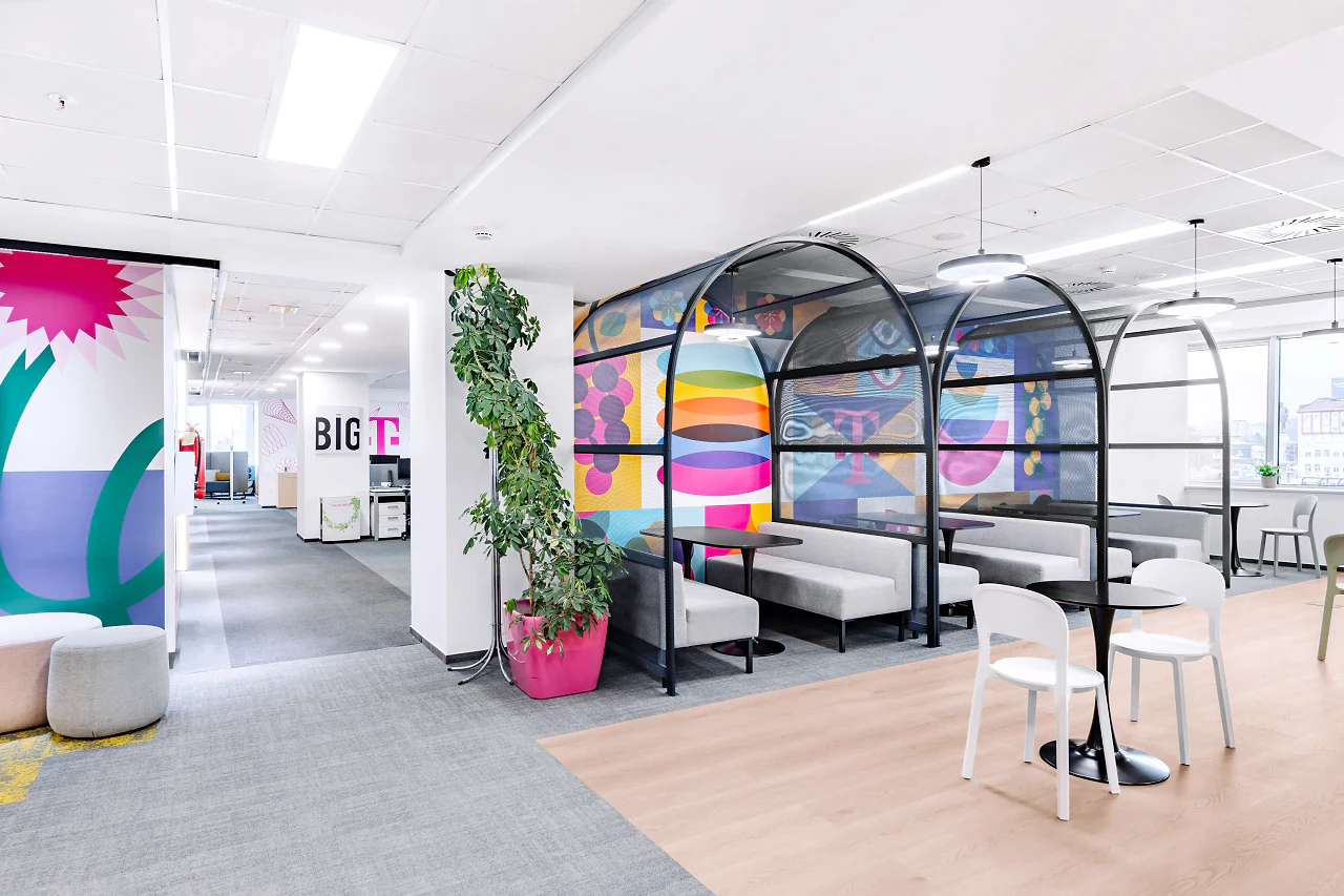 An open corridor with planting and the arched booths