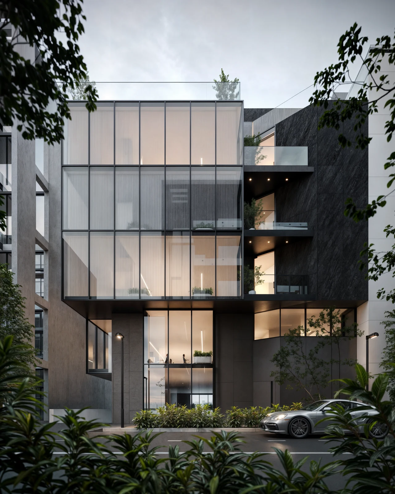 The Toros façade from the street, glazing stepped over a dark base