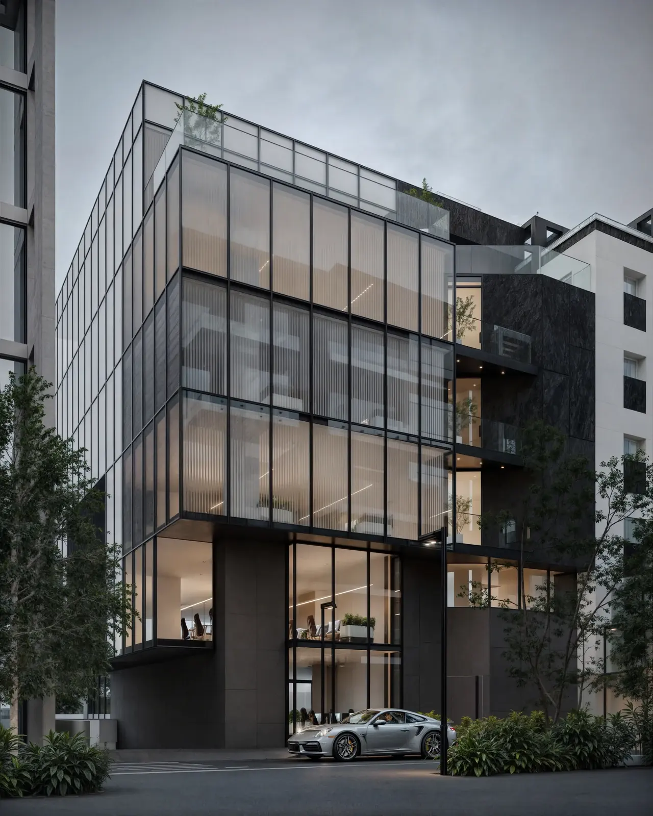 The glass corner of Toros Building with terraces at the top